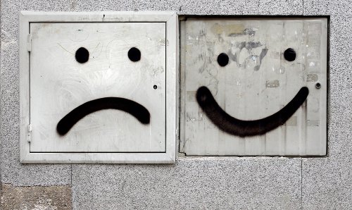 Happy and sad graffiti faces