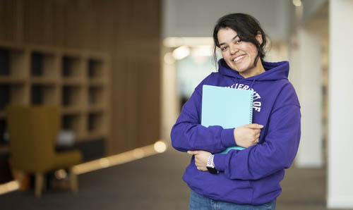 Female student holding a folder